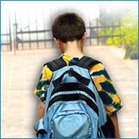 Bullying in our community - leaflets and guides Lonely school boy with his back turned