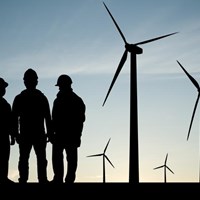 Environmental careers conference Men working on a wind turbine farm