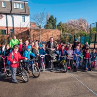 Photo5 Cllr Adam Clarke pictured with school children and their bikes