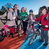 Photo7 Cllr Adam Clarke pictured with school children and their bikes with a representative from Sustrans