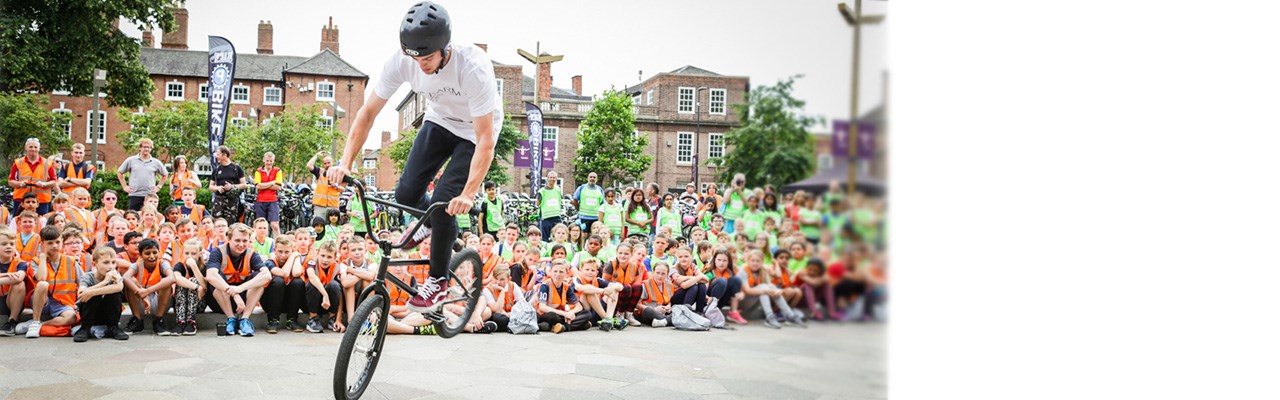 Young man performing tricks on his BMX bike
