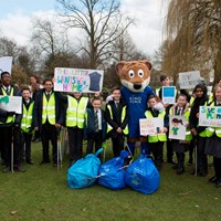 Litter Campaign 2018 - Photo 4 Children stood with Filbert Fox mascot behind bags of rubbish, holding up posters