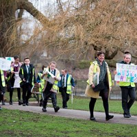 Litter Campaign 2018 - Photo 8 Children walking through the park with campaign posters