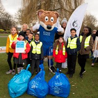 Litter Less Campaign 2018 28 Filbert Fox mascot gives a thumbs up, stood next to young volunteers