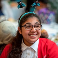Eco-Schools celebration 1 Happy smiling girl with funny bumblebee headband