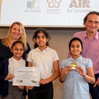 Eco-Schools celebration 54 Cllr Adam Clarke and Cllr Sarah Russell presenting a Healthier Air for Leicester Schools Award to children from Mellor Primary School