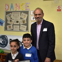 Grow Your Own Grub 2018 - 1 Cllr Piara Singh Clair presenting Silver award to two children from Scraptoft Valley Primary School