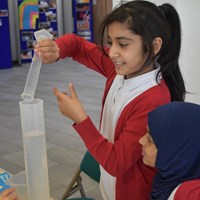 English Martyrs 2 Child from English Martyrs School pouring water into a graduated cylinder