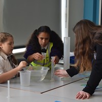 Fullhurst 12 Group of children working together on an experiment