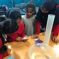 Rushey Mead 7 Children working together and reading a card