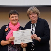 Sustainable Schools Celebration Evening 24 Jeanette Orrey MBE presenting award to Hannah Boydon